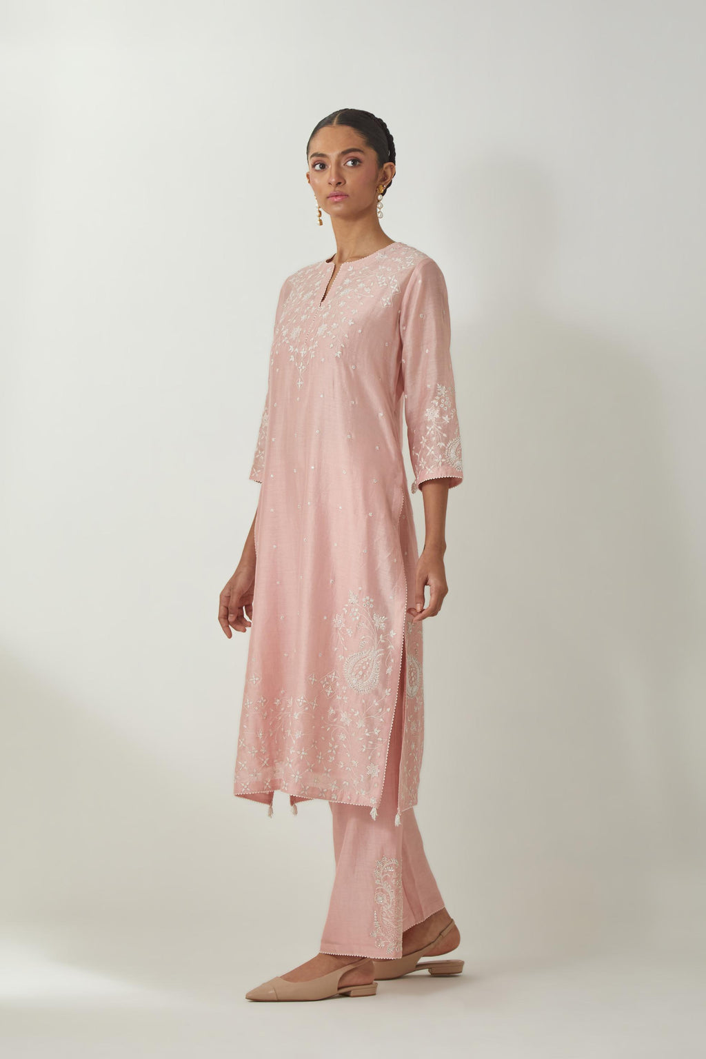 Pink silk Chanderi straight mid length kurta set with all-over off white silk thread embroidery, highlighted with beads, and sequins work at neck & hem.