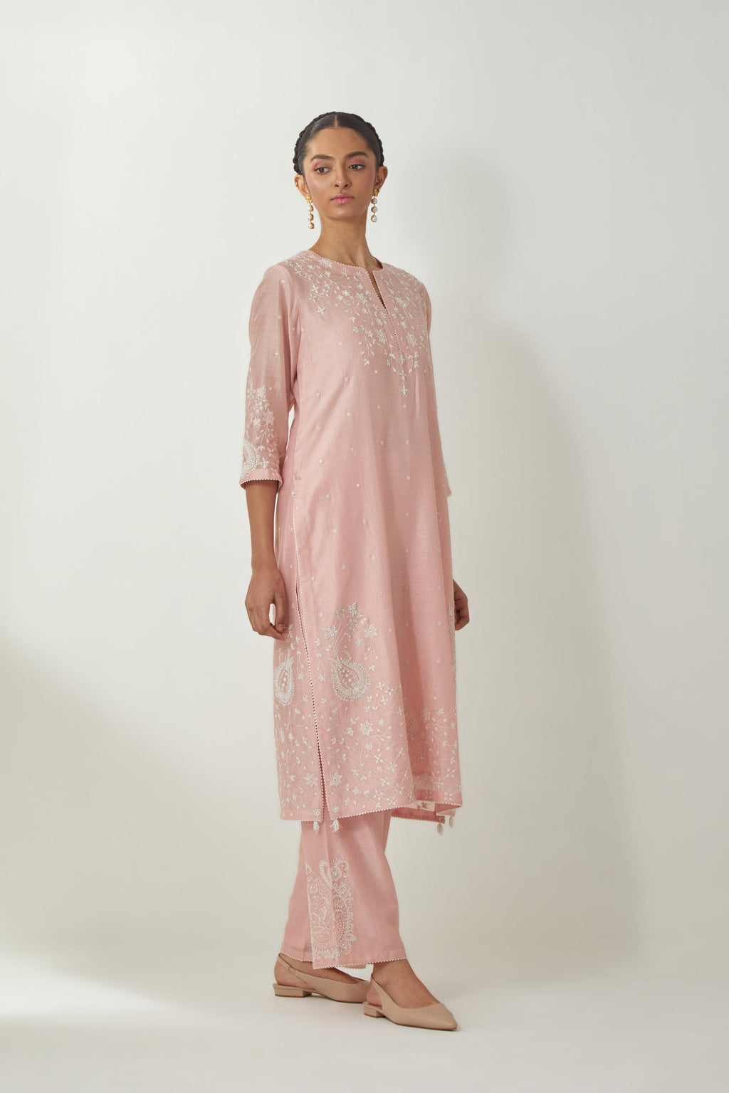 Pink silk Chanderi straight mid length kurta set with all-over off white silk thread embroidery, highlighted with beads, and sequins work at neck & hem.