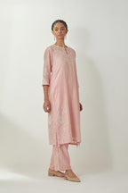 Pink silk Chanderi straight mid length kurta set with all-over off white silk thread embroidery, highlighted with beads, and sequins work at neck & hem.