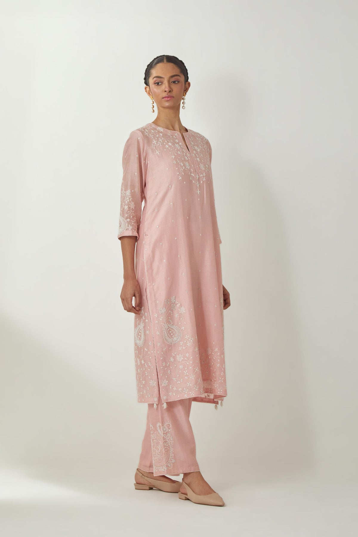Pink silk Chanderi straight mid length kurta set with all-over off white silk thread embroidery, highlighted with beads, and sequins work at neck & hem.