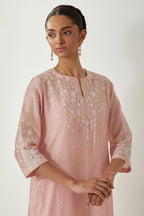 Pink silk Chanderi straight mid length kurta set with all-over off white silk thread embroidery, highlighted with beads, and sequins work at neck & hem.