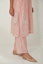Pink silk Chanderi straight mid length kurta set with all-over off white silk thread embroidery, highlighted with beads, and sequins work at neck & hem.
