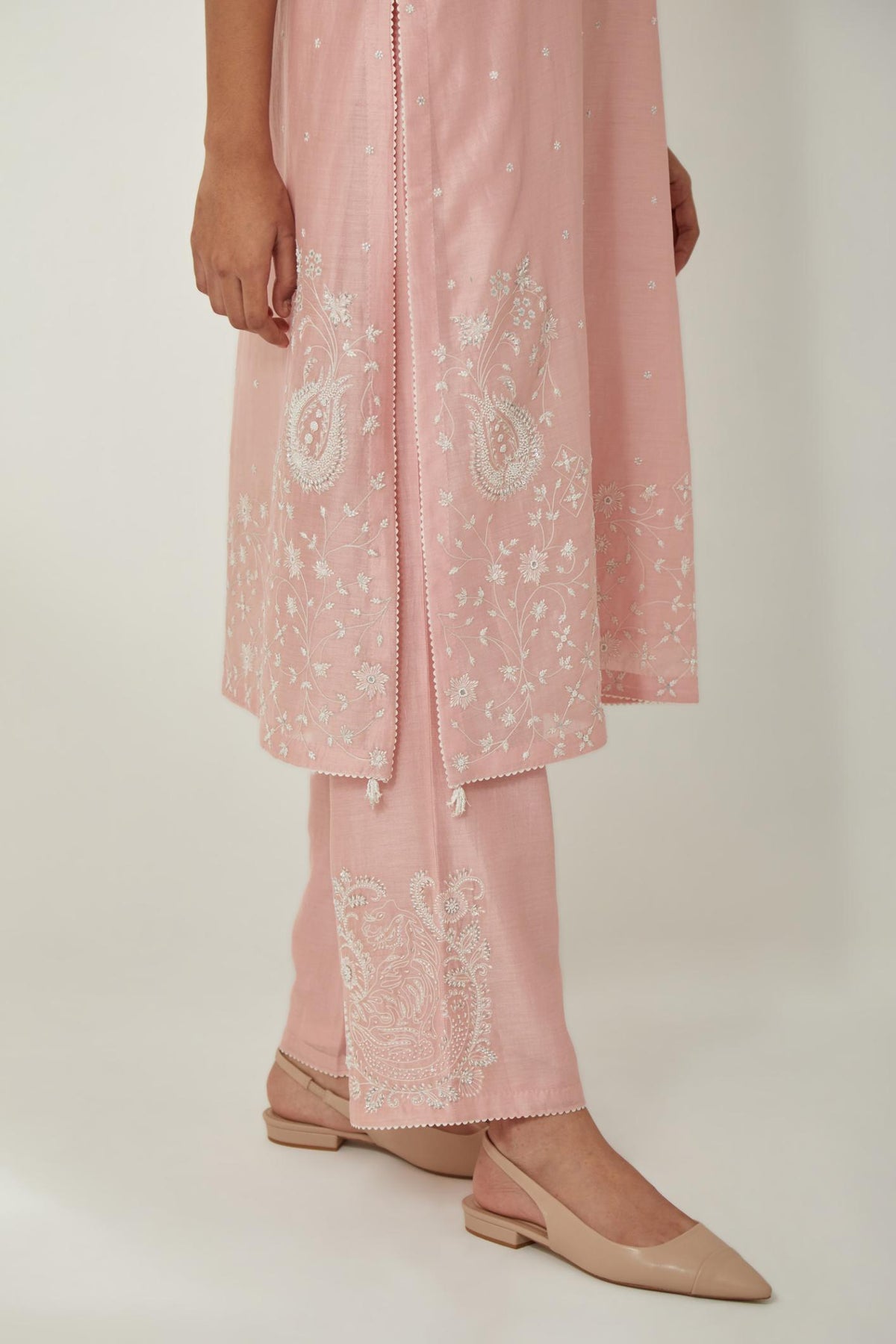 Pink silk Chanderi straight mid length kurta set with all-over off white silk thread embroidery, highlighted with beads, and sequins work at neck & hem.
