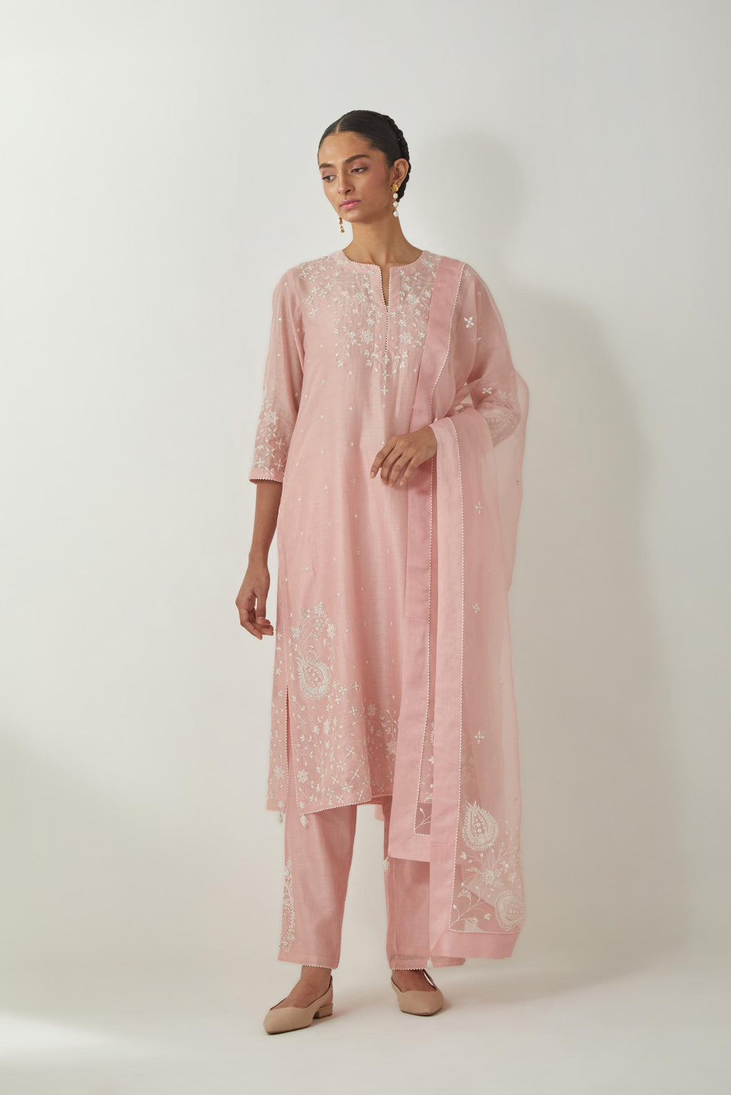 Pink silk Chanderi straight mid length kurta set with all-over off white silk thread embroidery, highlighted with beads, and sequins work at neck & hem.