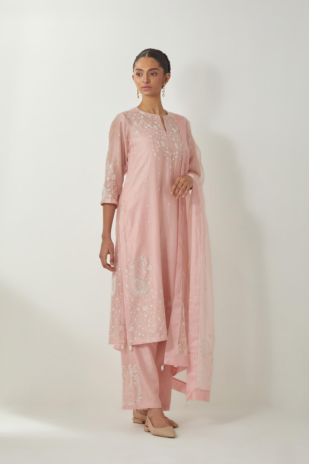 Pink silk Chanderi straight mid length kurta set with all-over off white silk thread embroidery, highlighted with beads, and sequins work at neck & hem.