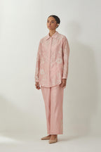 Pink silk Chanderi shirt with all-over off white silk thread embroidery, highlighted with sequins and beads work, paired with Pink silk Chanderi straight pants with embroidered boota at sides, highlighted with sequins and beads.