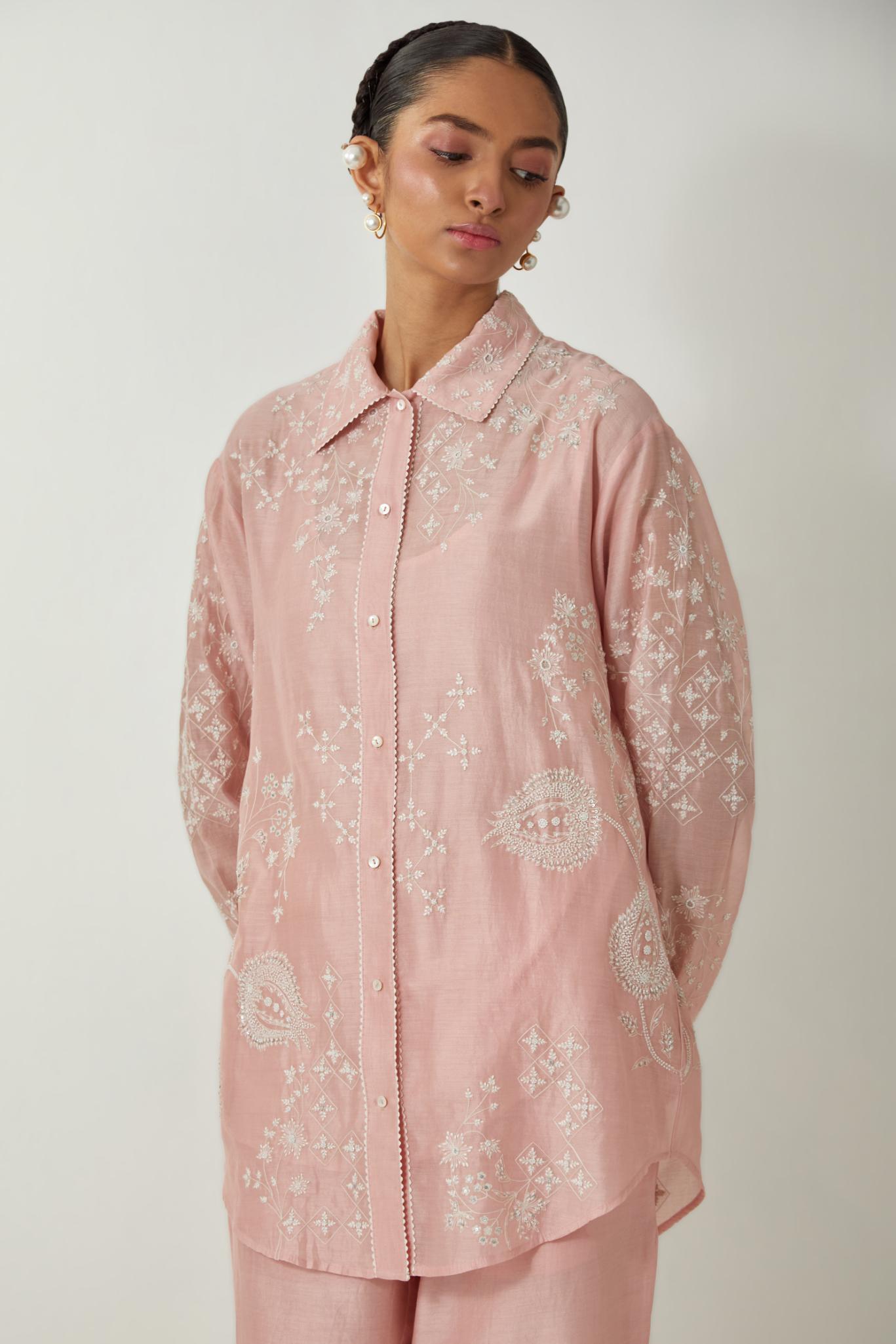 Pink silk Chanderi shirt with all-over off white silk thread embroidery, highlighted with sequins and beads work, paired with Pink silk Chanderi straight pants with embroidered boota at sides, highlighted with sequins and beads.