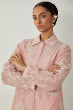 Pink silk Chanderi shirt with all-over off white silk thread embroidery, highlighted with sequins and beads work, paired with Pink silk Chanderi straight pants with embroidered boota at sides, highlighted with sequins and beads.