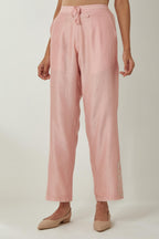 Pink silk Chanderi straight pants with embroidered boota at sides, highlighted with sequins and beads.