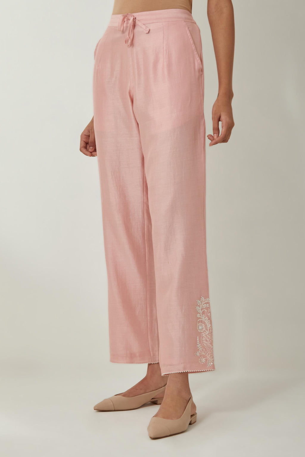 Pink silk Chanderi straight pants with embroidered boota at sides, highlighted with sequins and beads.