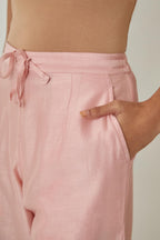 Pink silk Chanderi straight pants with embroidered boota at sides, highlighted with sequins and beads.