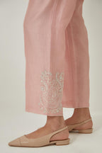 Pink silk Chanderi straight pants with embroidered boota at sides, highlighted with sequins and beads.