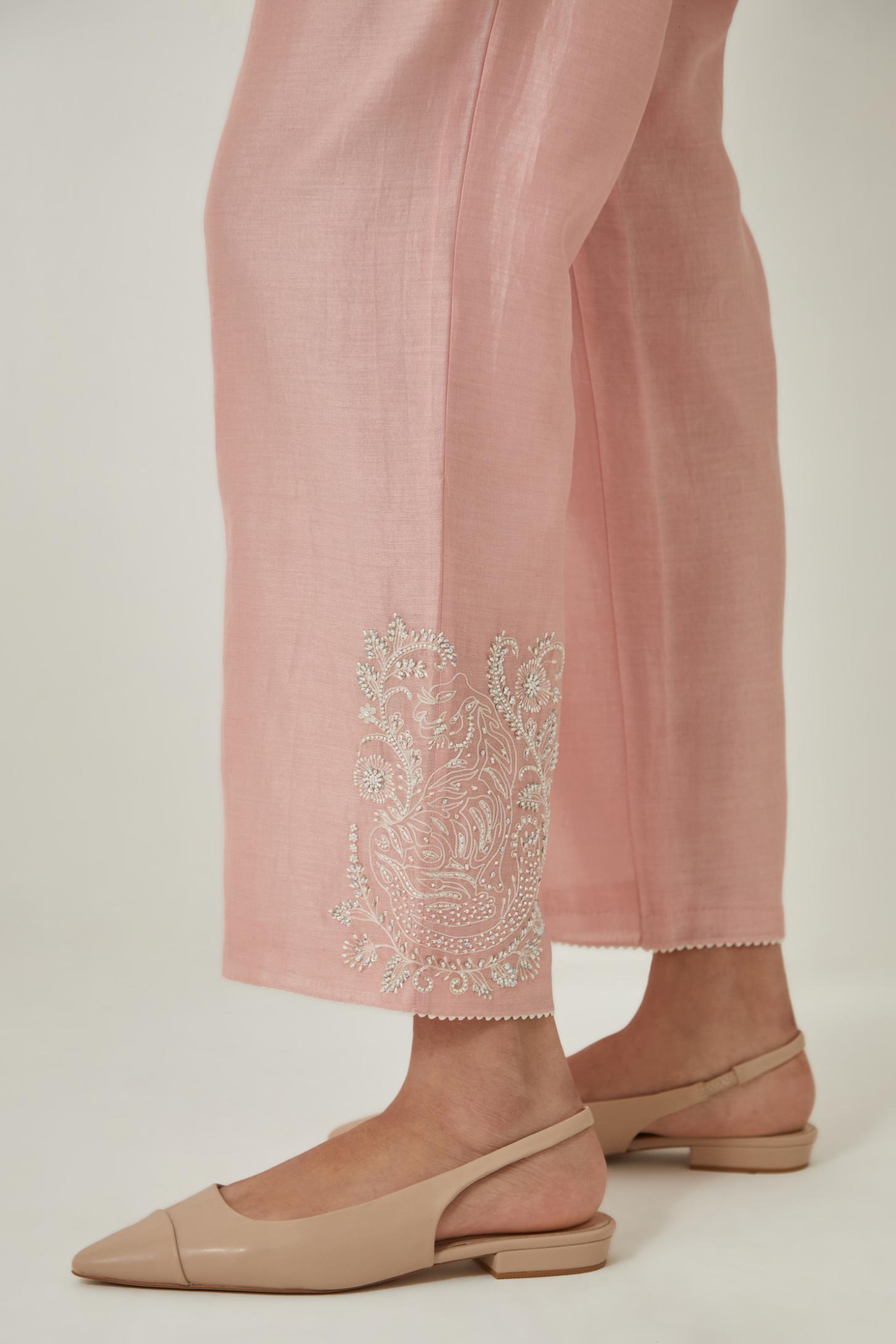 Pink silk Chanderi straight pants with embroidered boota at sides, highlighted with sequins and beads.