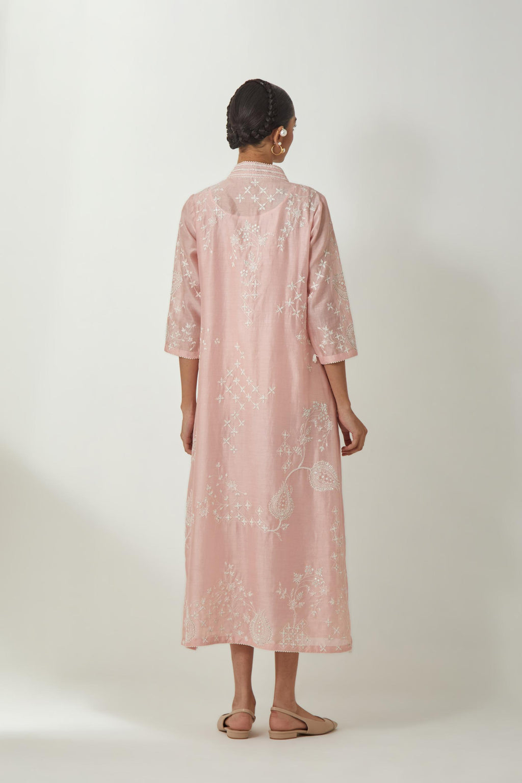 Pink silk Chanderi easy fit dress with all-over off white silk thread embroidery, highlighted with beads and sequins work.