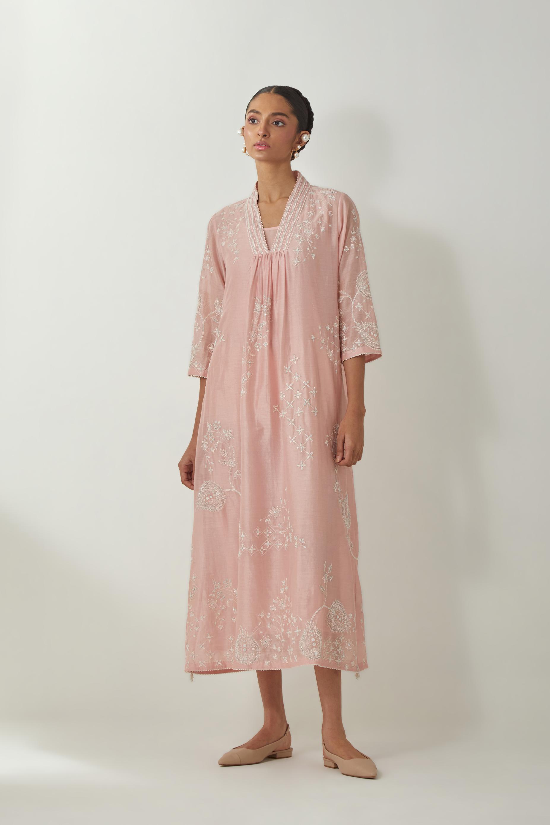 Pink silk Chanderi easy fit dress with all-over off white silk thread embroidery, highlighted with beads and sequins work.