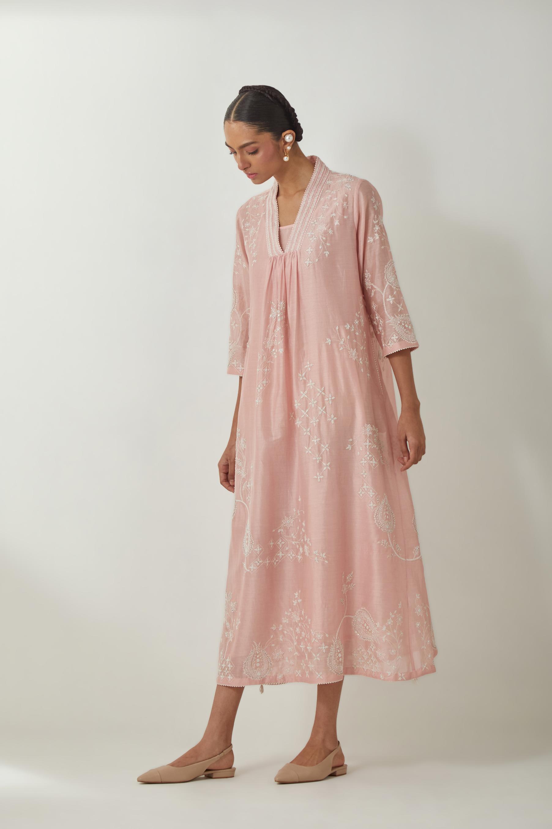 Pink silk Chanderi easy fit dress with all-over off white silk thread embroidery, highlighted with beads and sequins work.