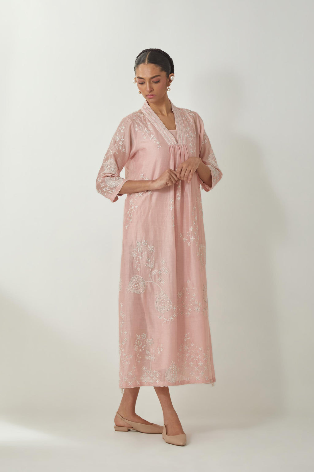 Pink silk Chanderi easy fit dress with all-over off white silk thread embroidery, highlighted with beads and sequins work.