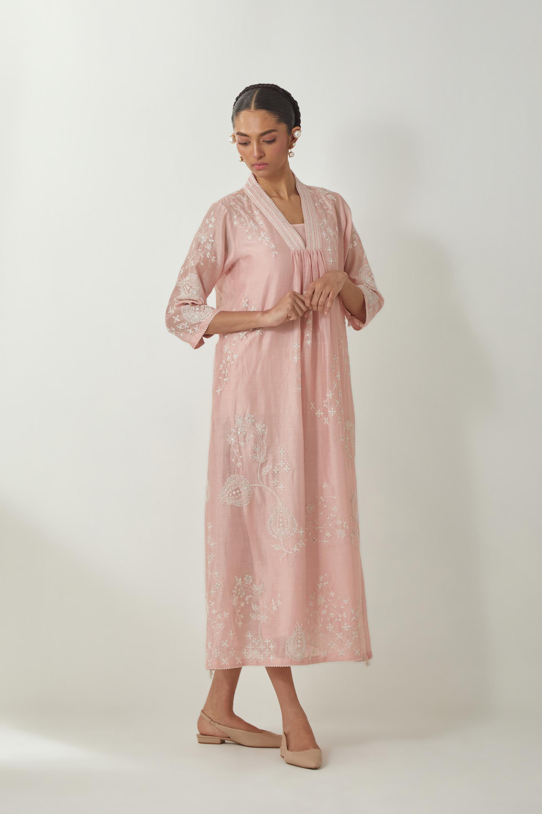 Pink silk Chanderi easy fit dress with all-over off white silk thread embroidery, highlighted with beads and sequins work.