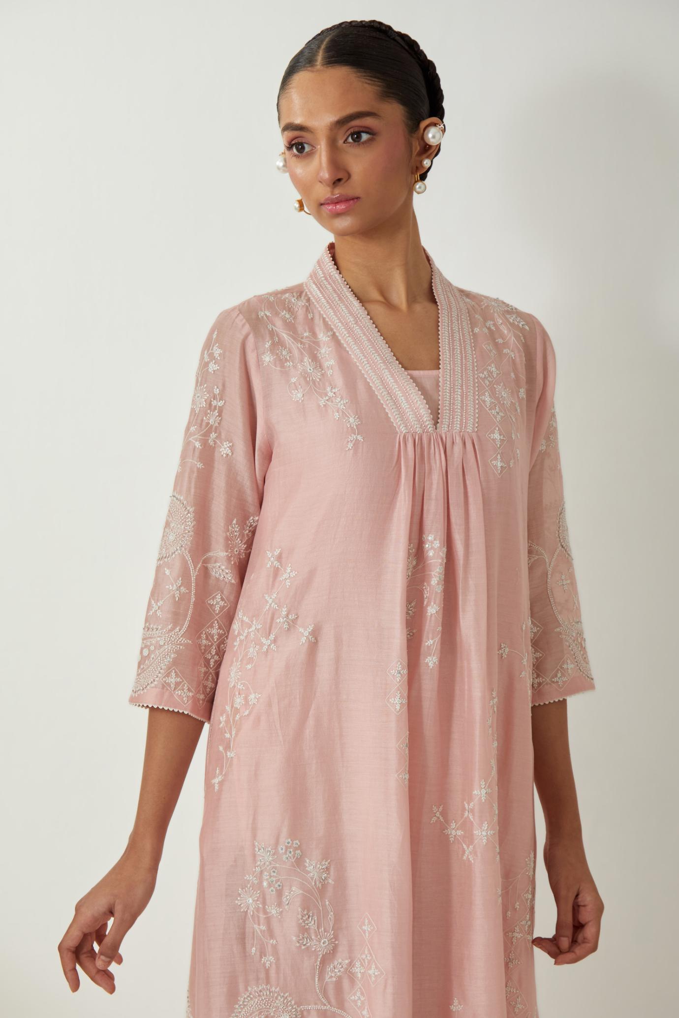 Pink silk Chanderi easy fit dress with all-over off white silk thread embroidery, highlighted with beads and sequins work.