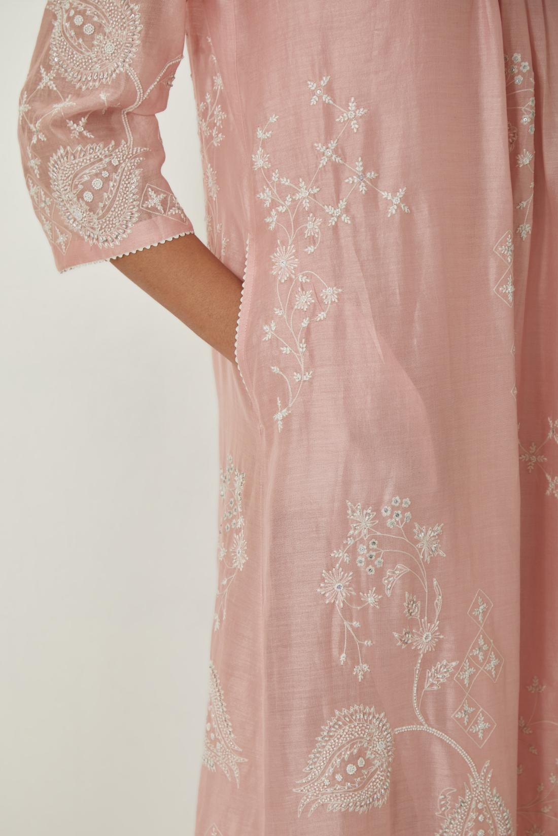 Pink silk Chanderi easy fit dress with all-over off white silk thread embroidery, highlighted with beads and sequins work.