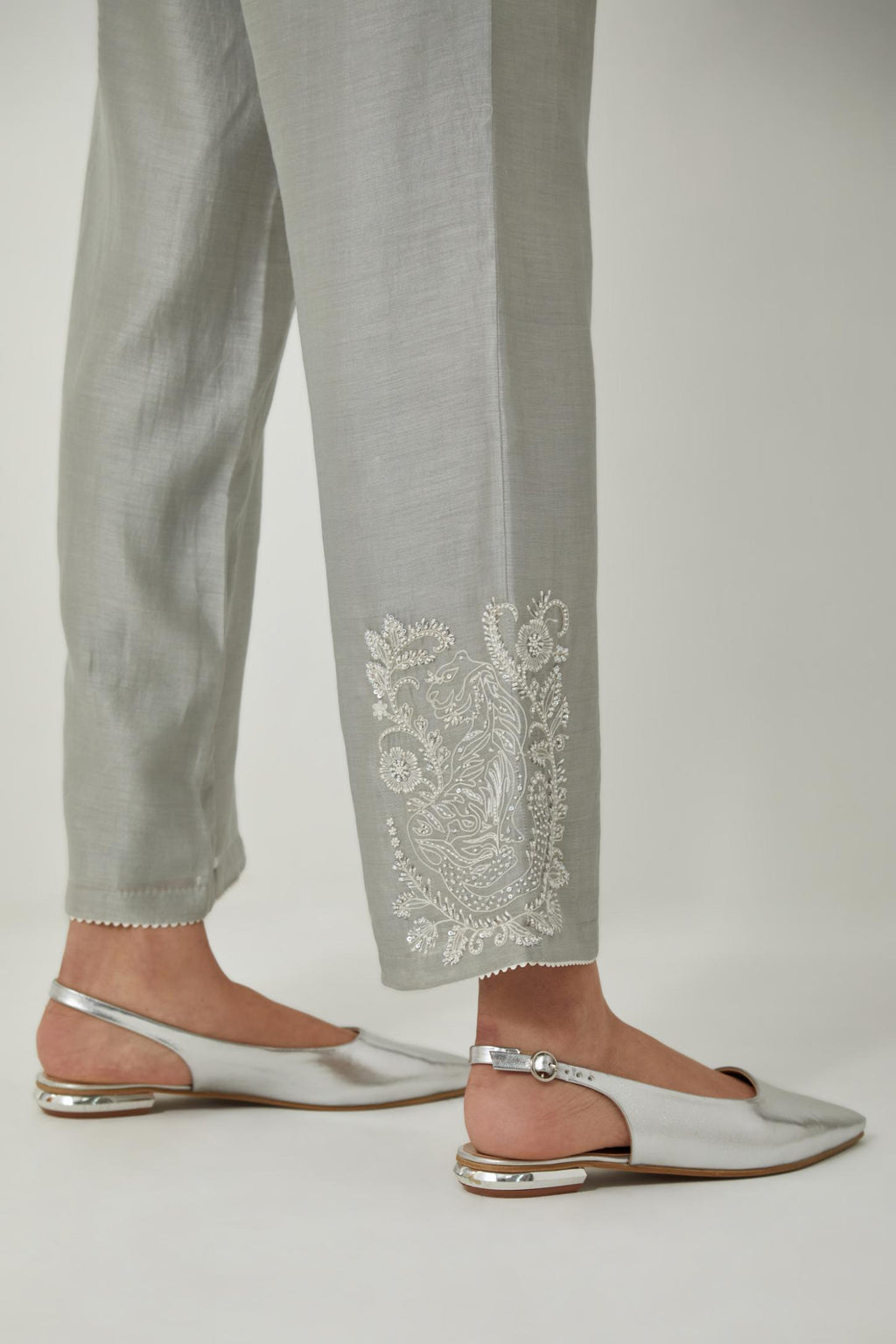 Bluish Grey silk Chanderi straight pants with embroidered boota at sides, highlighted with sequins and beads.