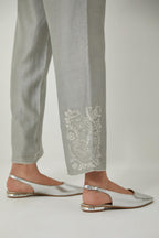 Bluish Grey silk Chanderi straight pants with embroidered boota at sides, highlighted with sequins and beads.