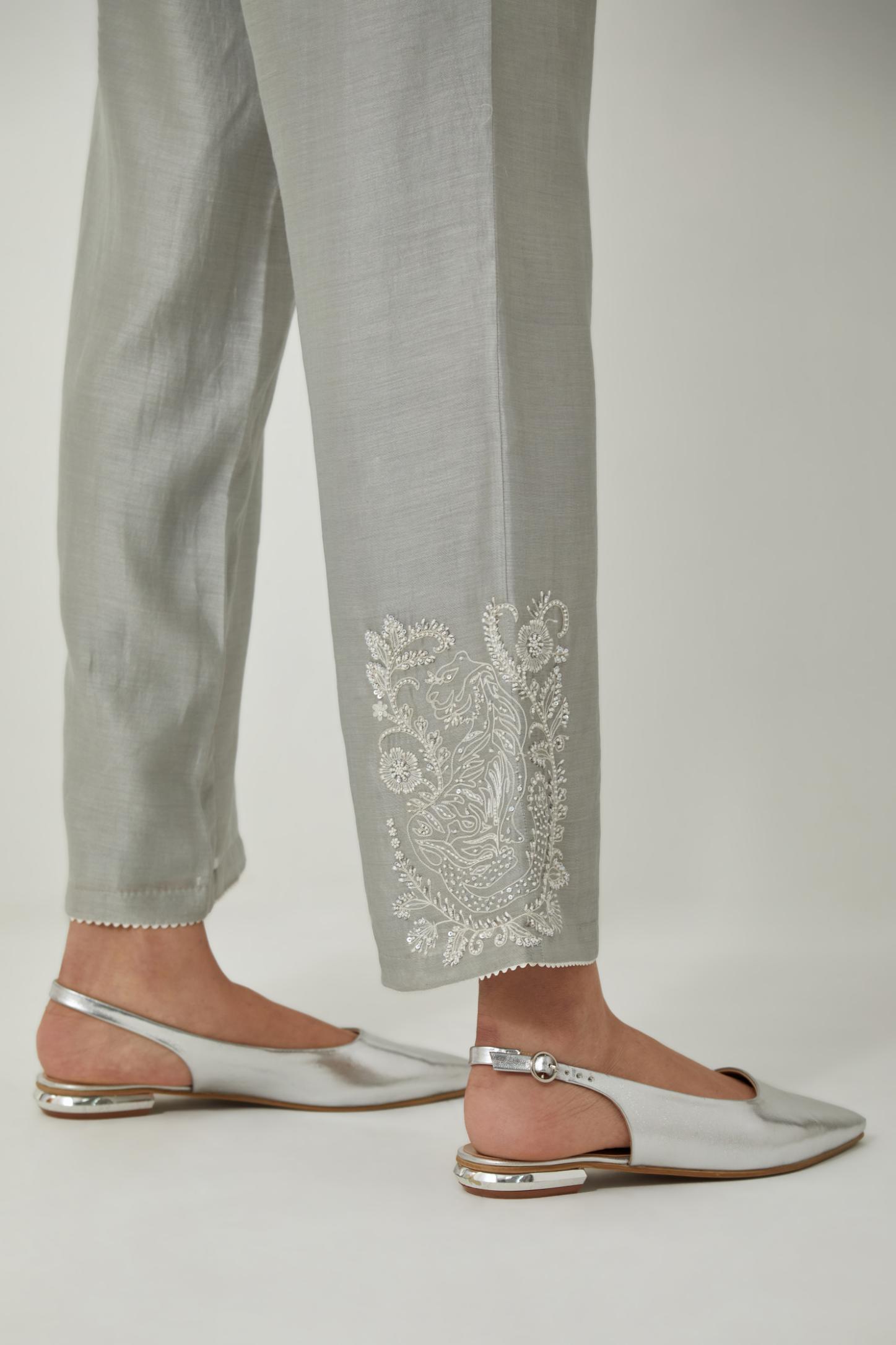 Bluish Grey silk Chanderi straight pants with embroidered boota at sides, highlighted with sequins and beads.