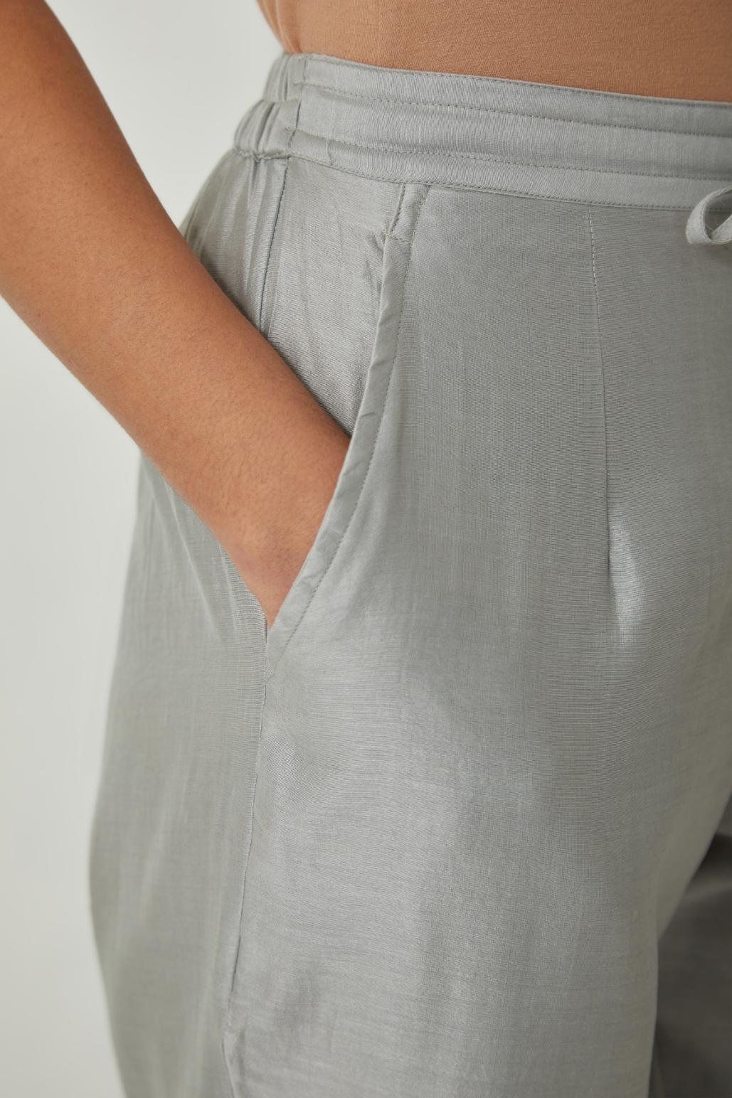 Bluish Grey silk Chanderi straight pants with embroidered boota at sides, highlighted with sequins and beads.