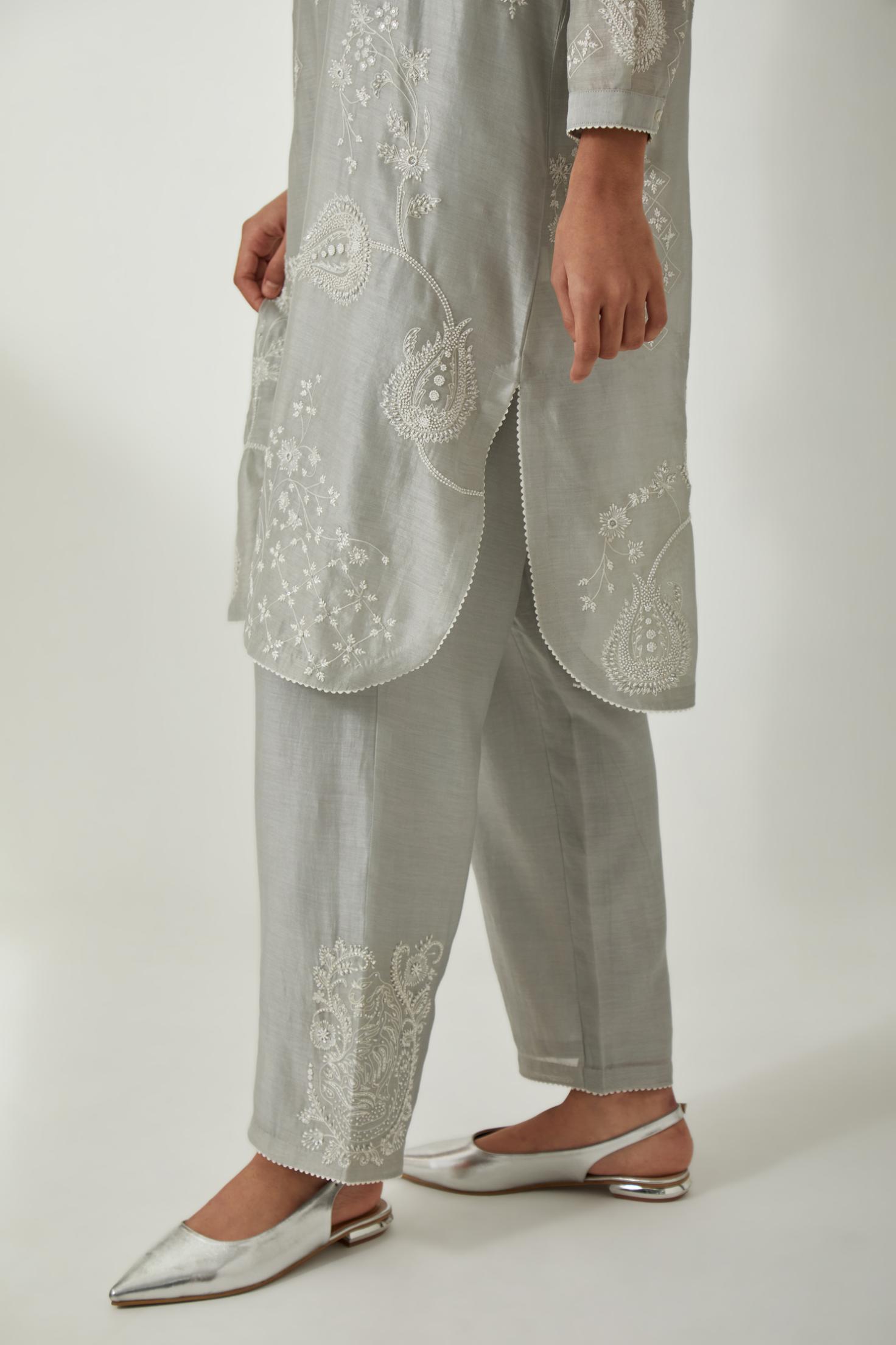 Bluish Grey silk Chandri straight short kurta with all-over off white silk thread embroidery, highlighted with beads and sequins work,  paired with Bluish Grey silk Chanderi straight pants with embroidered boota at sides, highlighted with sequins and bead