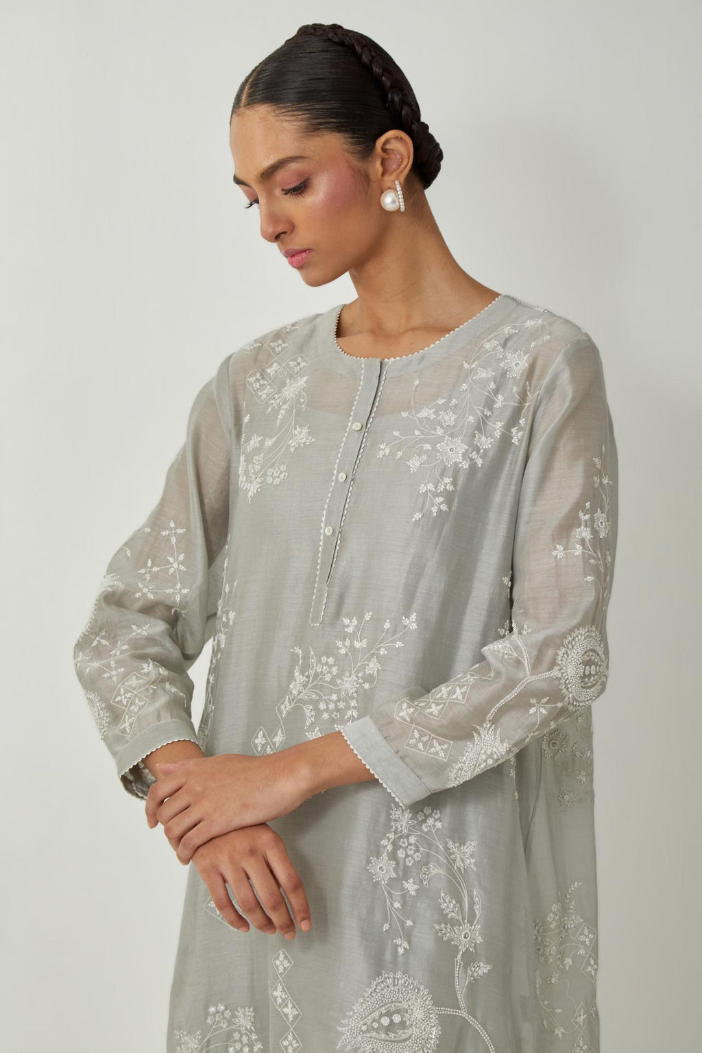Bluish Grey silk Chandri straight short kurta with all-over off white silk thread embroidery, highlighted with beads and sequins work,  paired with Bluish Grey silk Chanderi straight pants with embroidered boota at sides, highlighted with sequins and bead