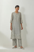 Bluish Grey silk Chanderi straight mid length kurta set with all-over off white silk thread embroidery, highlighted with beads, and sequins work at neck & hem.