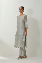 Bluish Grey silk Chanderi straight mid length kurta set with all-over off white silk thread embroidery, highlighted with beads, and sequins work at neck & hem.