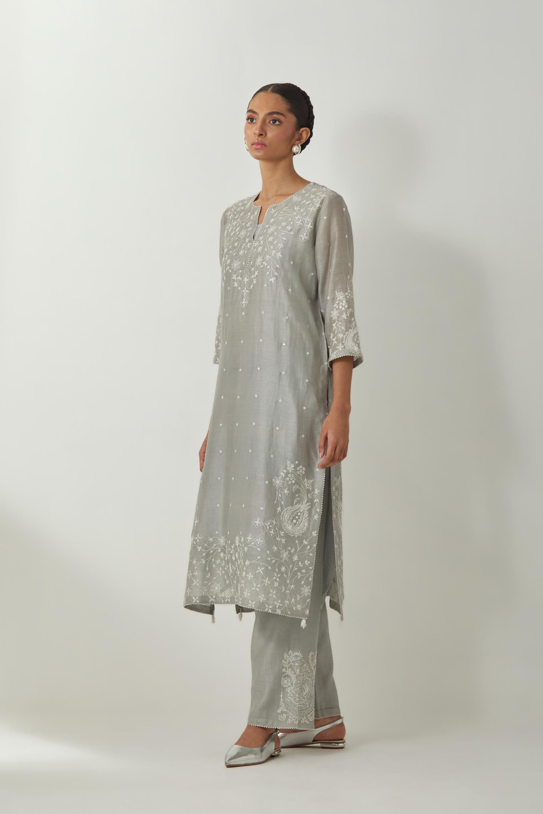 Bluish Grey silk Chanderi straight mid length kurta set with all-over off white silk thread embroidery, highlighted with beads, and sequins work at neck & hem.