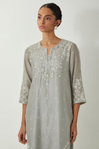 Bluish Grey silk Chanderi straight mid length kurta set with all-over off white silk thread embroidery, highlighted with beads, and sequins work at neck & hem.