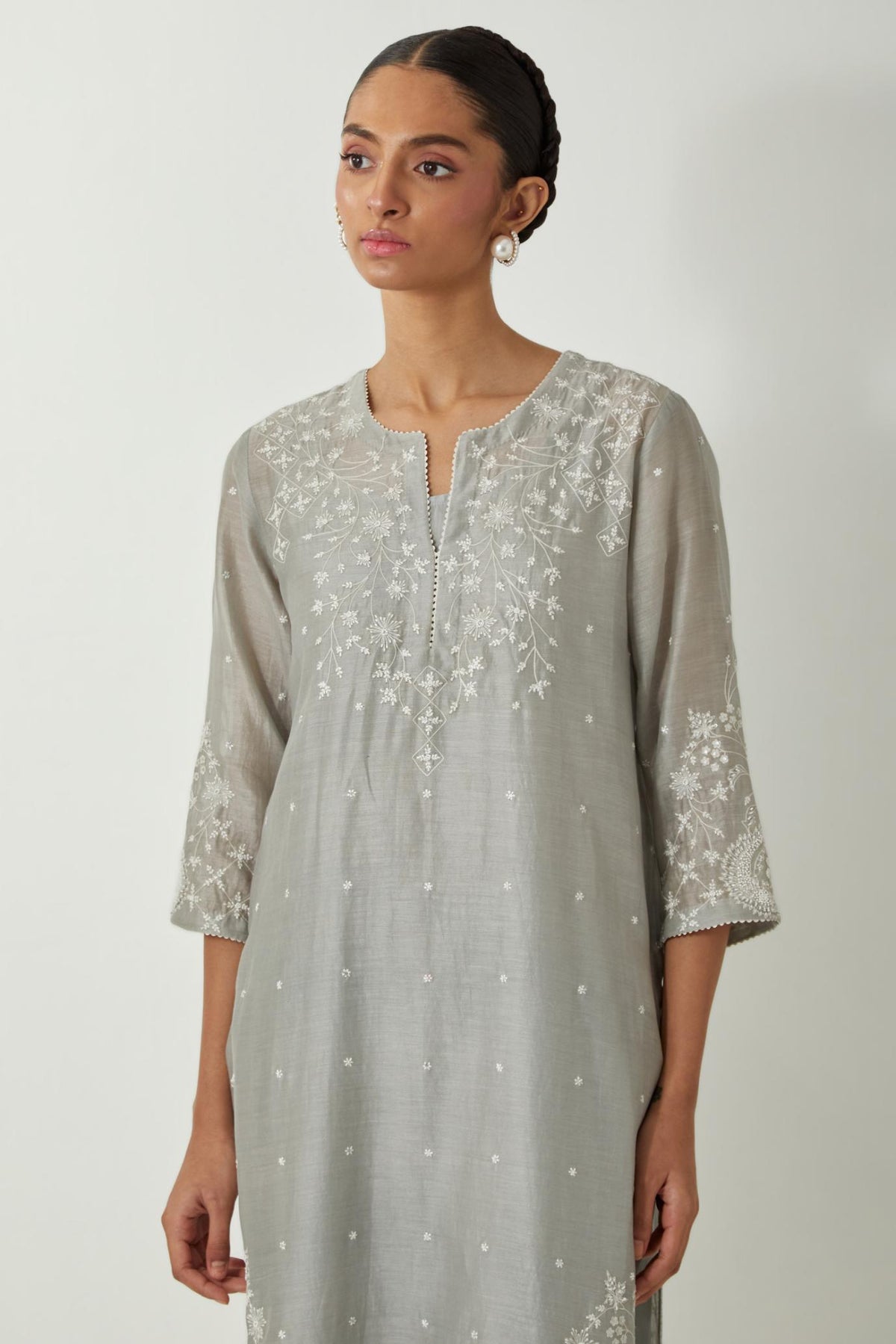 Bluish Grey silk Chanderi straight mid length kurta set with all-over off white silk thread embroidery, highlighted with beads, and sequins work at neck & hem.