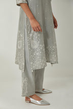 Bluish Grey silk Chanderi straight mid length kurta set with all-over off white silk thread embroidery, highlighted with beads, and sequins work at neck & hem.