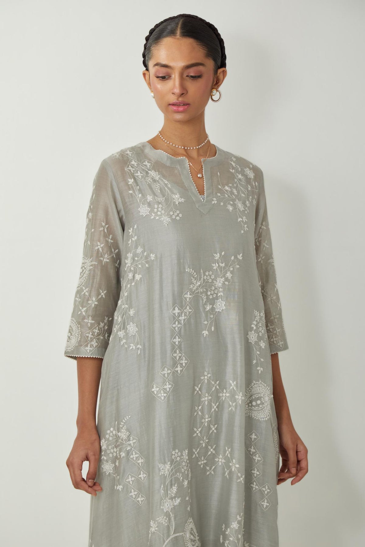 Bluish Grey silk Chanderi short easy fit kurta set with straight hem and all-over off white silk thread embroidery, highlighted with beads and sequins work.