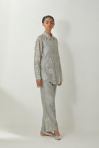 Bluish Grey silk Chanderi shirt with all-over off white silk thread embroidery, highlighted with sequins and beads work, paired with Bluish Grey silk Chanderi straight pants with embroidered boota at sides, highlighted with sequins and beads.
