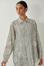 Bluish Grey silk Chanderi shirt with all-over off white silk thread embroidery, highlighted with sequins and beads work, paired with Bluish Grey silk Chanderi straight pants with embroidered boota at sides, highlighted with sequins and beads.