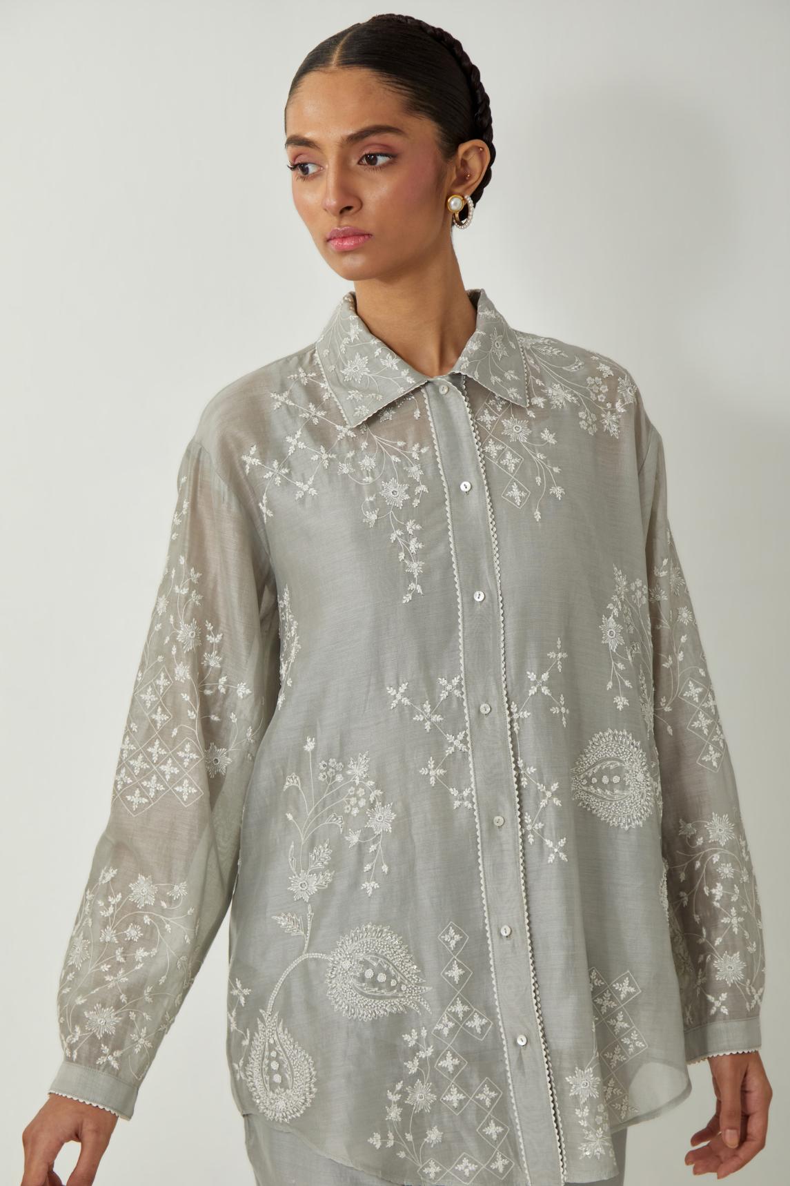 Bluish Grey silk Chanderi shirt with all-over off white silk thread embroidery, highlighted with sequins and beads work, paired with Bluish Grey silk Chanderi straight pants with embroidered boota at sides, highlighted with sequins and beads.