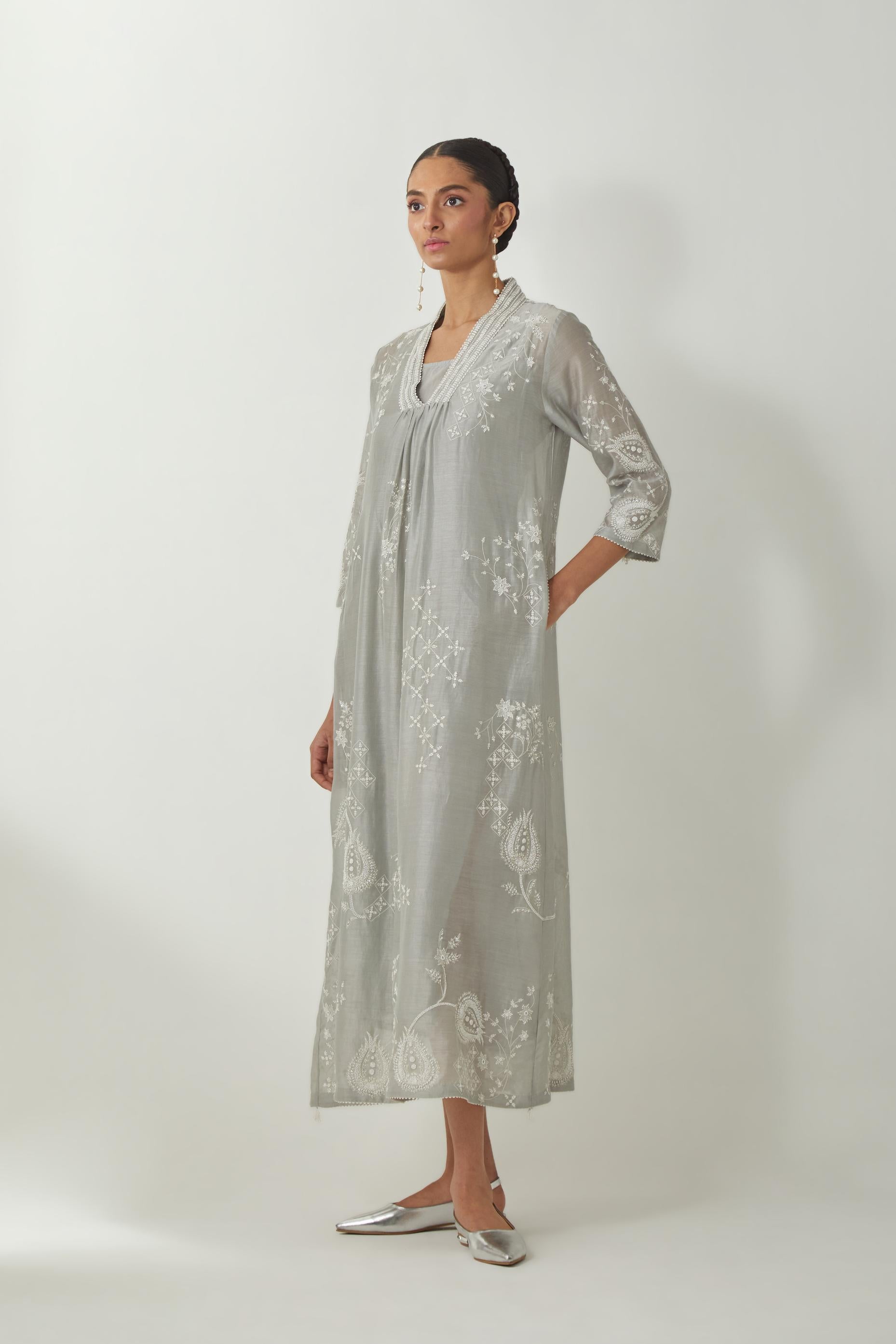 Bluish Grey silk Chanderi easy fit dress with all-over off white silk thread embroidery, highlighted with beads and sequins work.