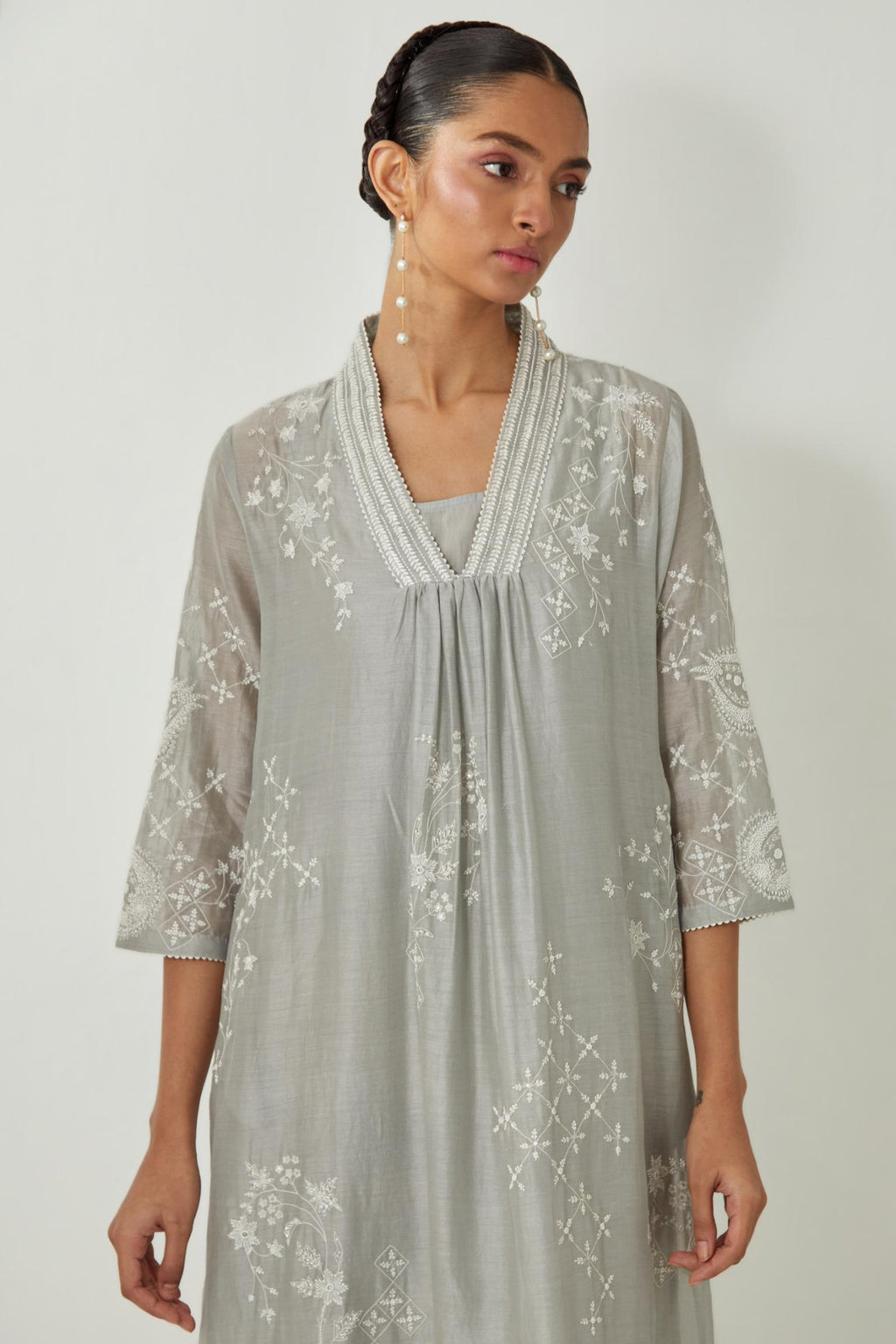 Bluish Grey silk Chanderi easy fit dress with all-over off white silk thread embroidery, highlighted with beads and sequins work.