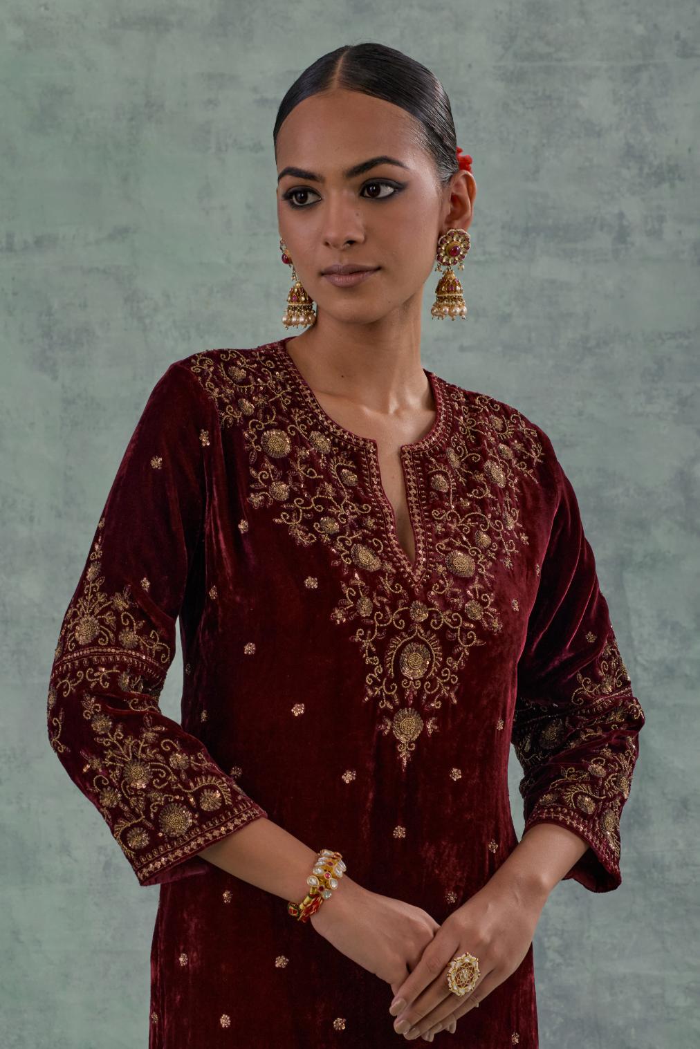 Deep maroonstraight Silk Velvet kurta set with all-over hand-embroidered bead, sequins and zari work.