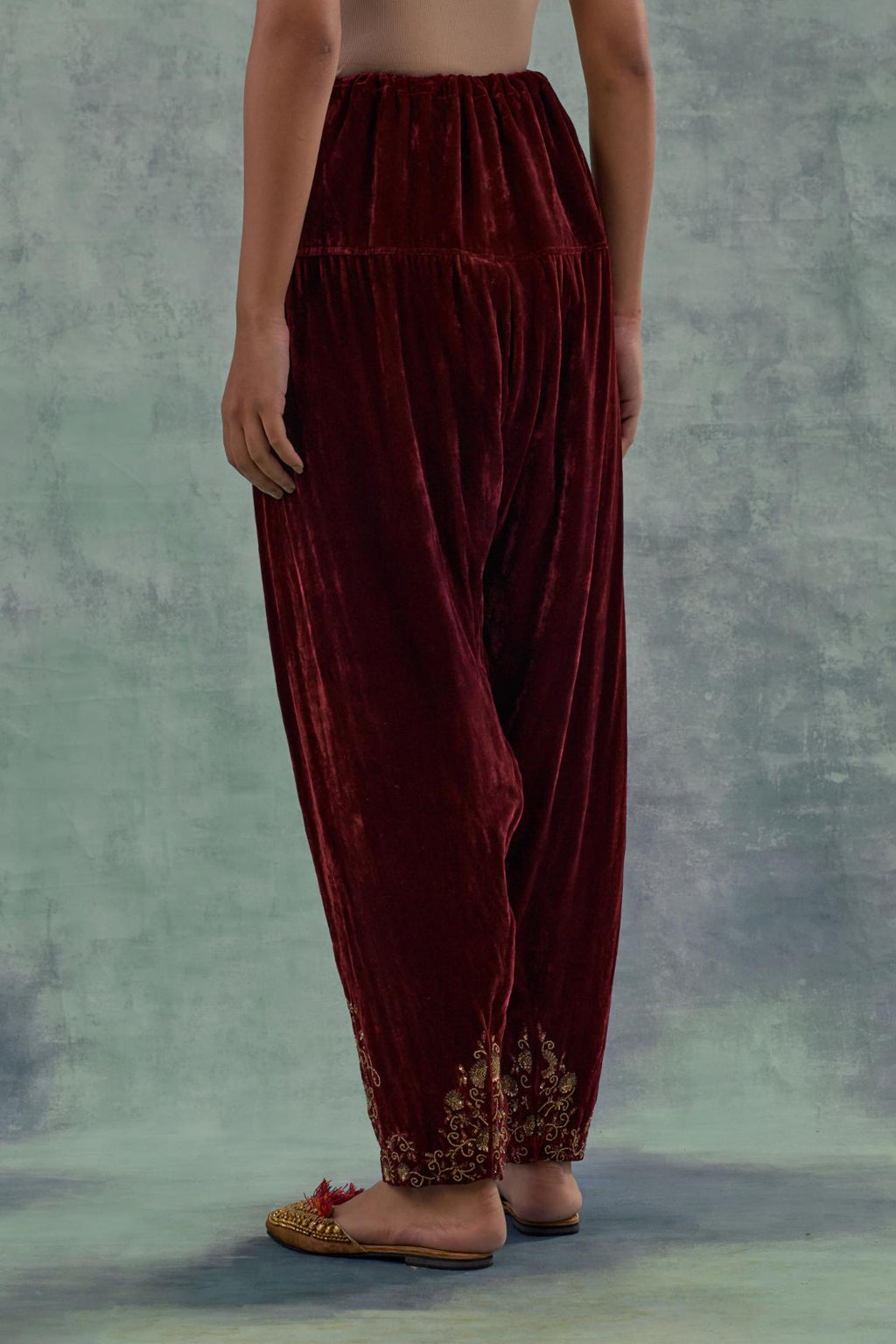 Deep maroon Silk velvet salwar, highlighted with hand embroidered bead, sequins and zari motifs.