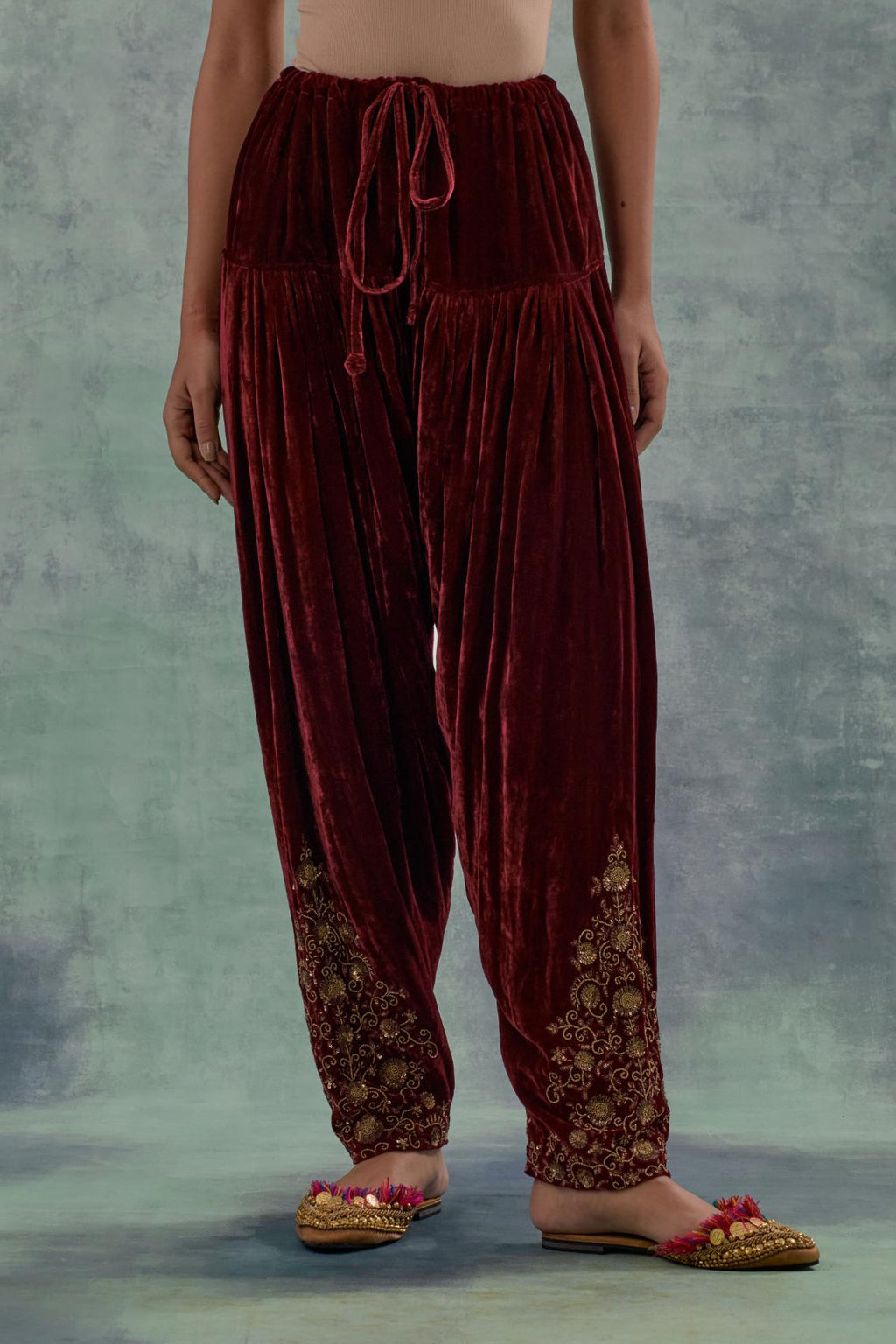 Deep maroon Silk velvet salwar, highlighted with hand embroidered bead, sequins and zari motifs.