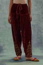 Deep maroon Silk velvet salwar, highlighted with hand embroidered bead, sequins and zari motifs.