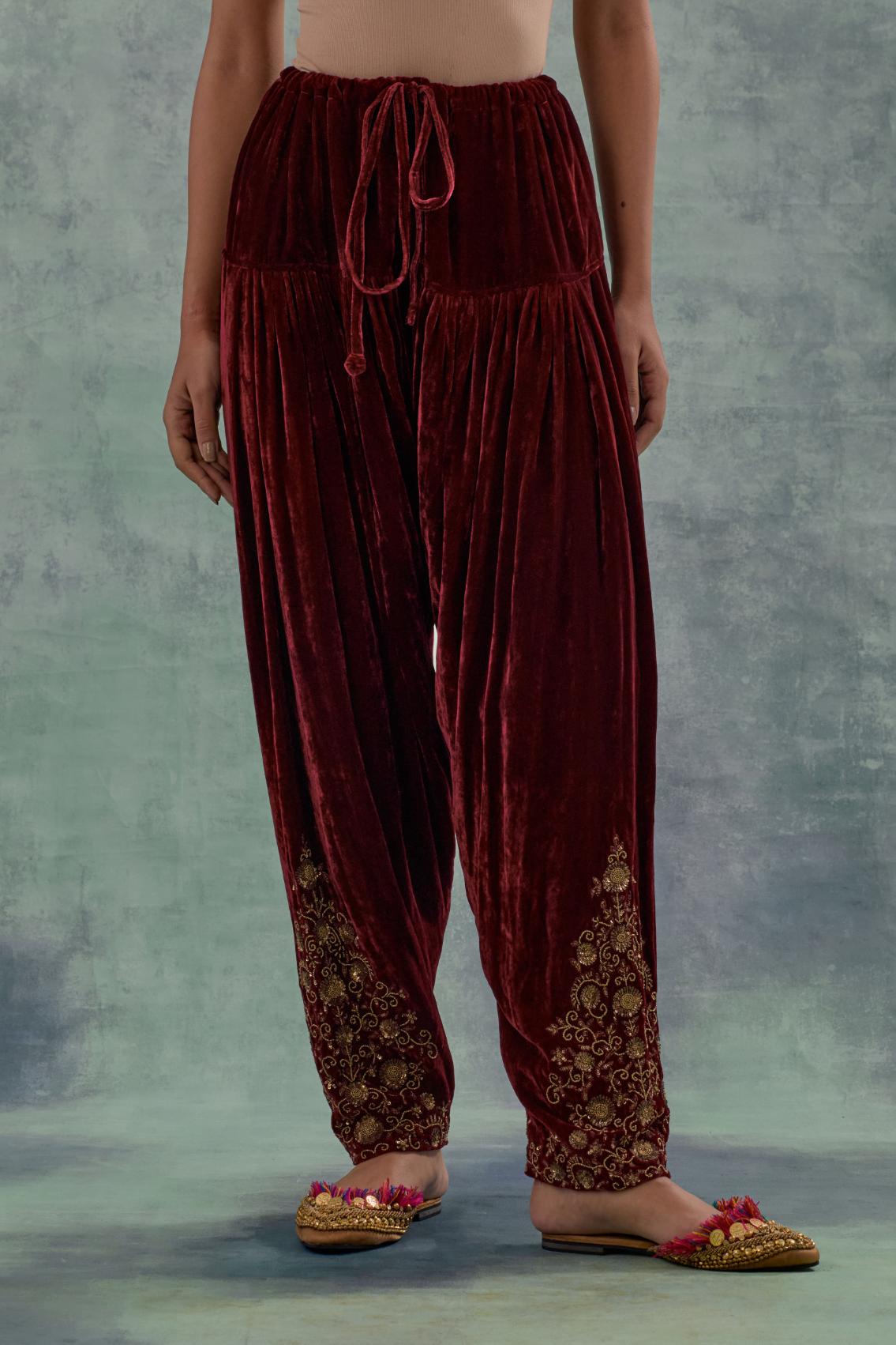 Deep maroon Silk velvet salwar, highlighted with hand embroidered bead, sequins and zari motifs.