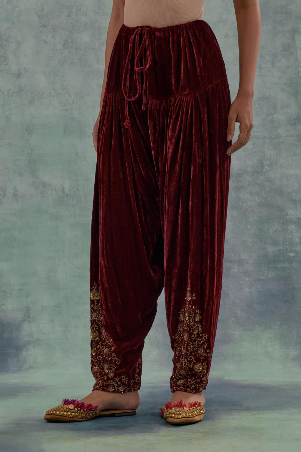 Deep maroon Silk velvet salwar, highlighted with hand embroidered bead, sequins and zari motifs.