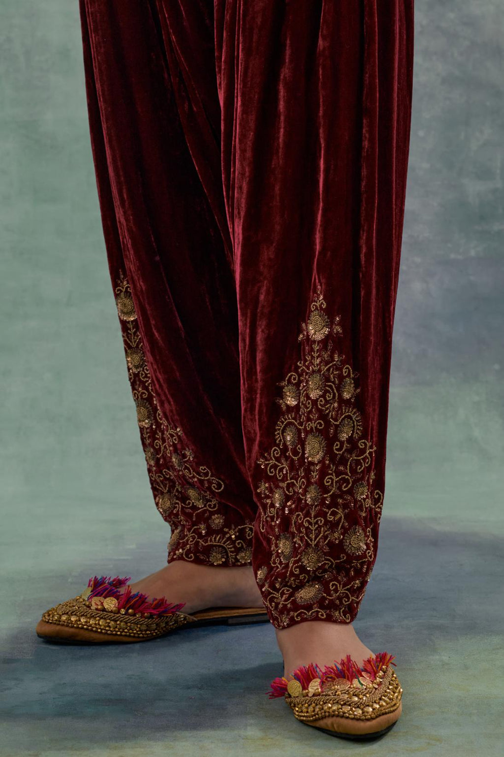 Deep maroon Silk velvet salwar, highlighted with hand embroidered bead, sequins and zari motifs.