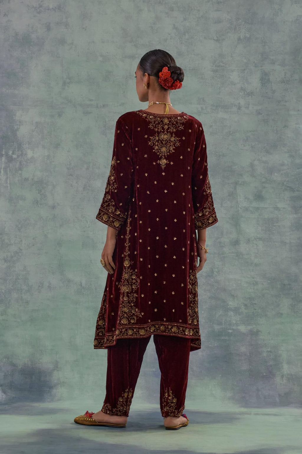 Deep maroon easy fit A-line, panelled, short kurta set in silk velvet with all-over hand embroidery at the neck, sleeves and hem.